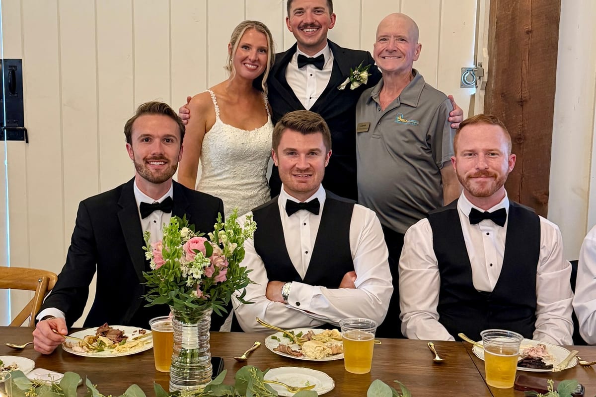 Wedding couple celebrating with loved ones